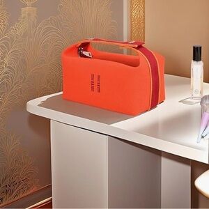 Bright Orange Travel Bag with Red Stripe